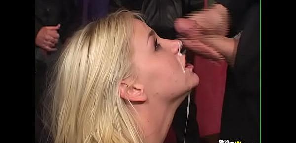  Blonde with big boobs sucks a group of guys until she gets face filled with cum
